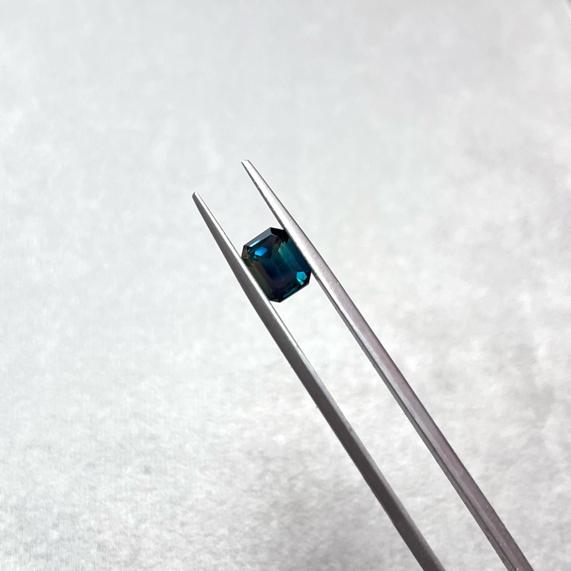 emerald cut Teal sapphire