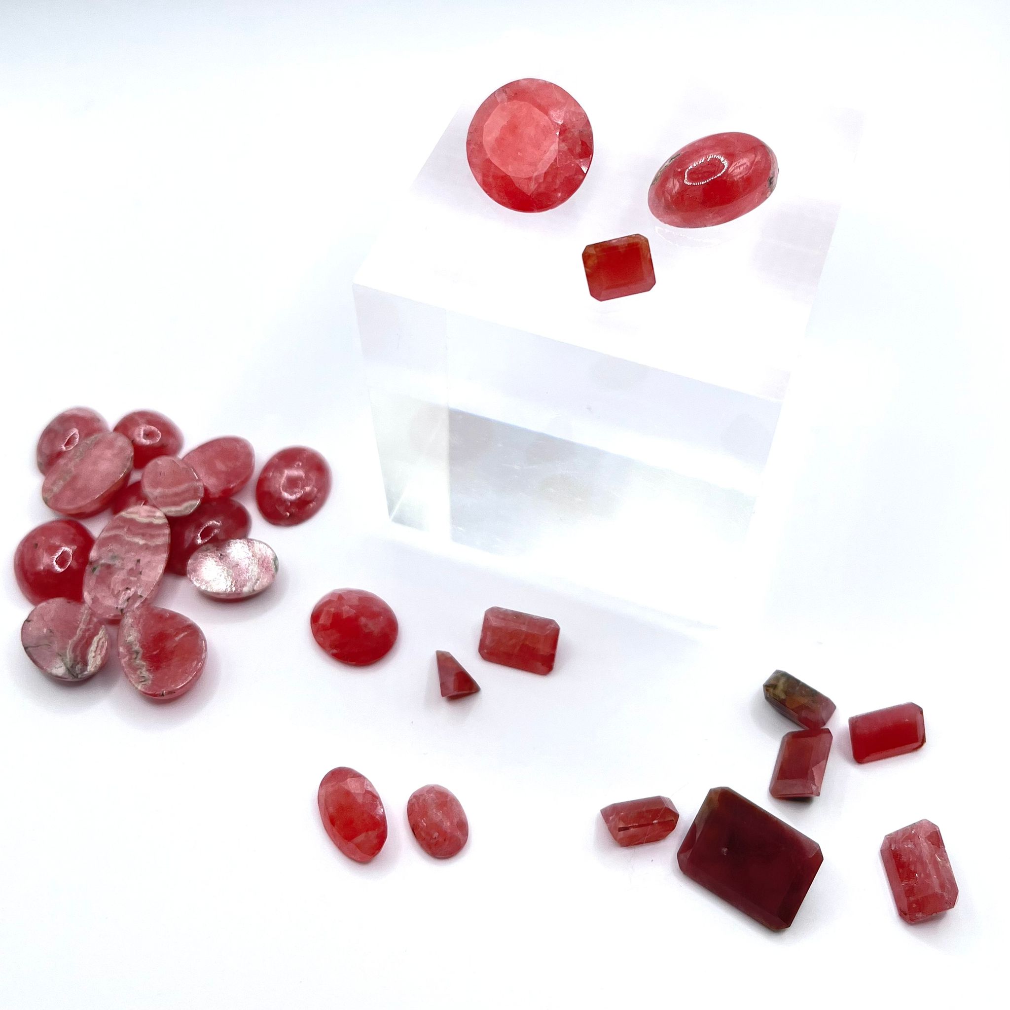 lot of rhodochrosite cut en cabochon as well as faceted